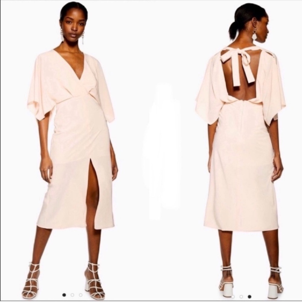 Topshop Batwing V-neck midi dress
Size 6
Solid hue in soft blush shade
